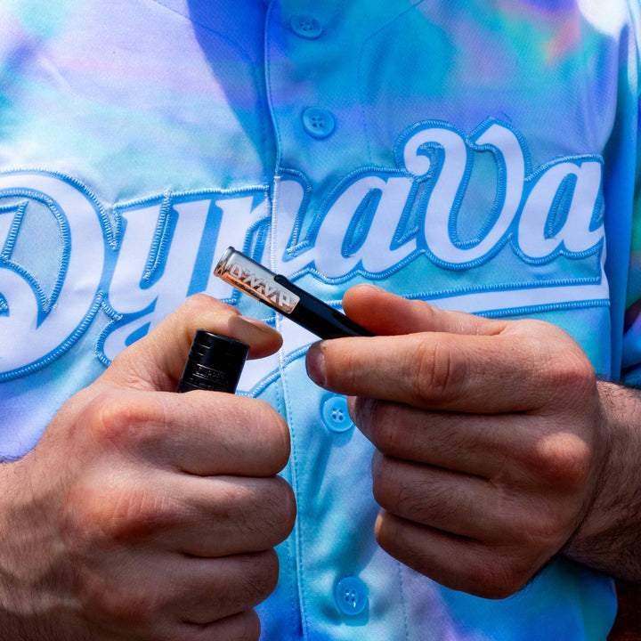 DynaVap G3 Vaporizer in hand heating blue shirt