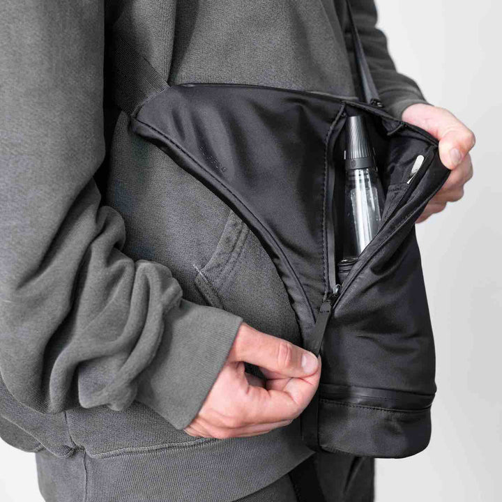 Puffco Journey bag person holding open peak inside