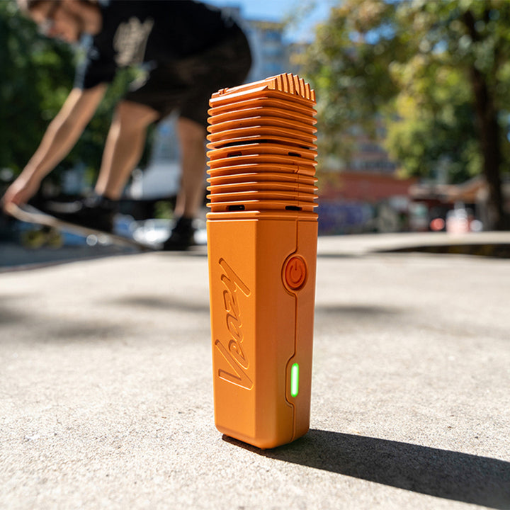 Veazy vaporizer storz and bickel inspiring orange sunshine skater in background