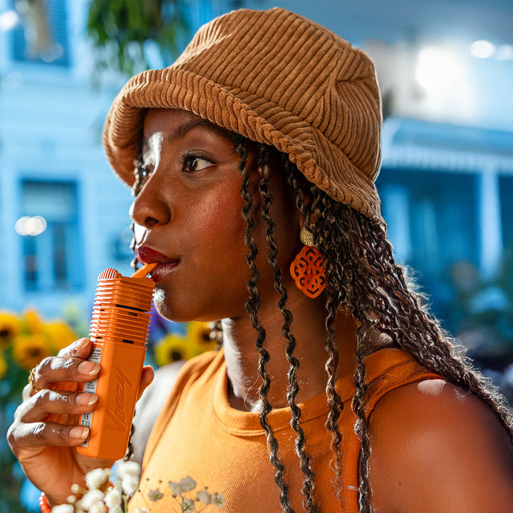 Veazy vaporizer storz and bickel inspiring orange woman holding